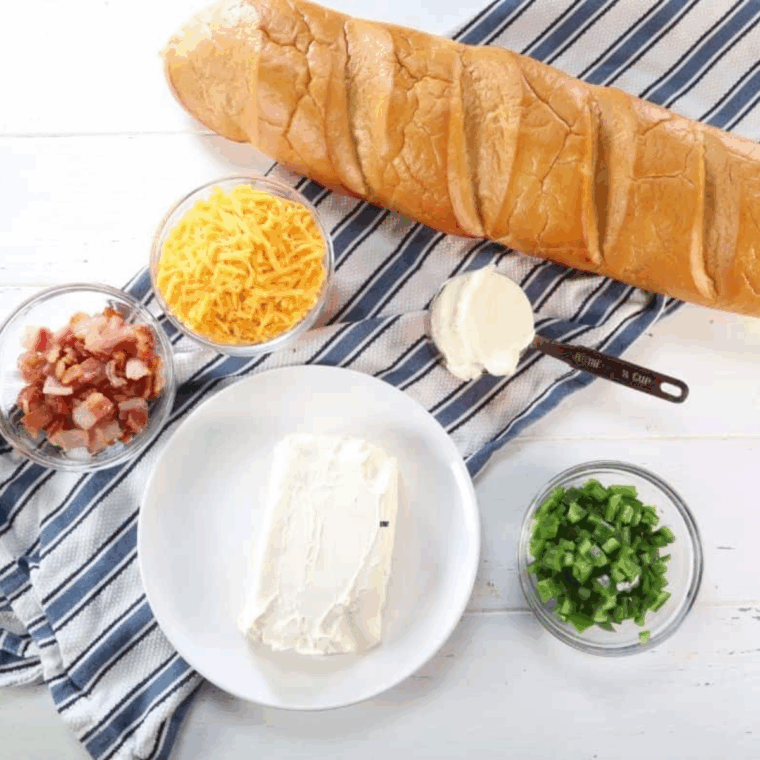 Ingredients needed for Air Fryer Jalapeno Popper Stuffed Bread on kitchen table.