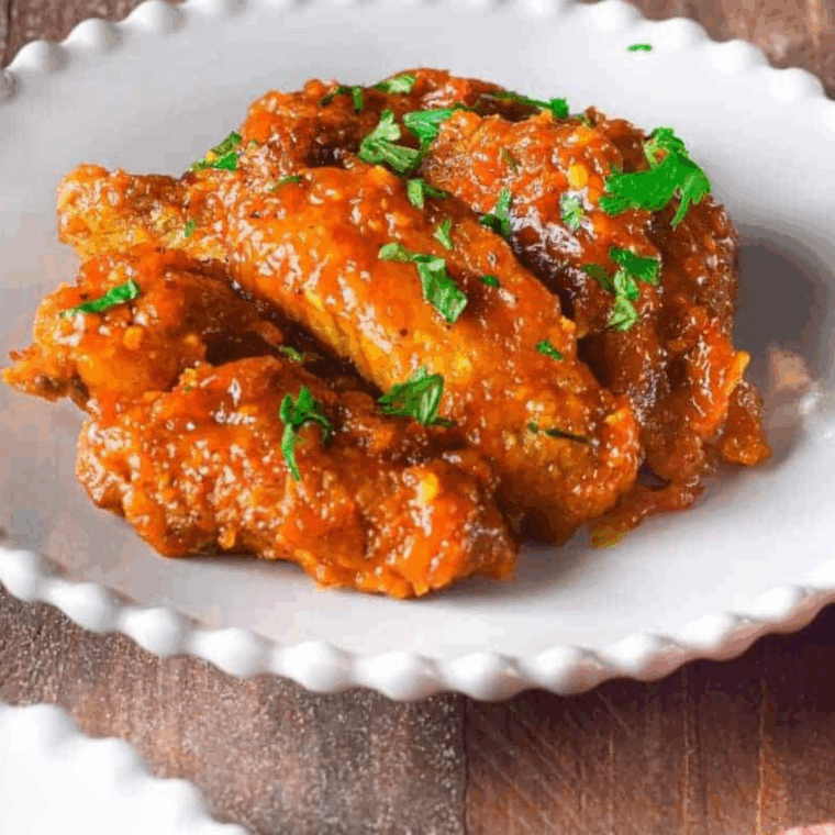 Close-up of sticky, flavorful sweet chili chicken wings ready to enjoy.