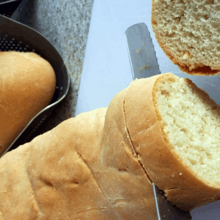 sliced bread drizzled with olive oil in air fryer basket