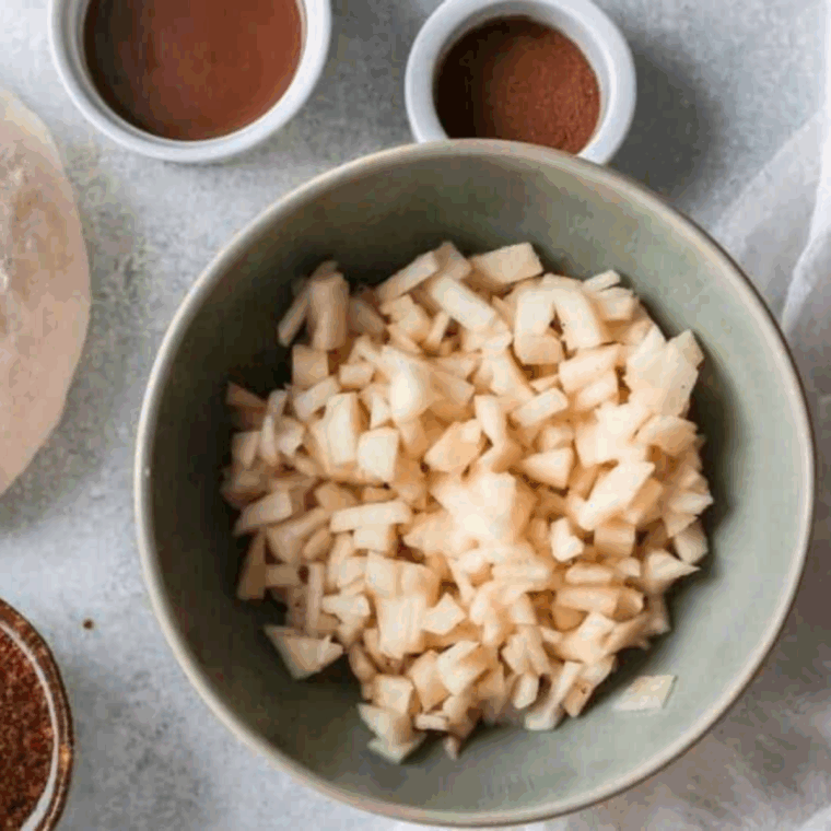 Ingredients needed for Easy Air Fryer Apple Cinnamon Roll on kitchen table.