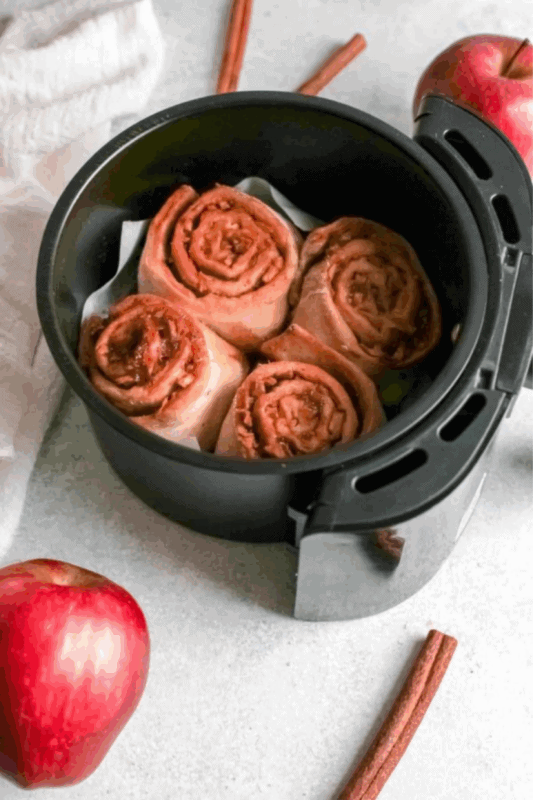 Place Easy Air Fryer Apple Cinnamon Rolls in the air fryer basket.