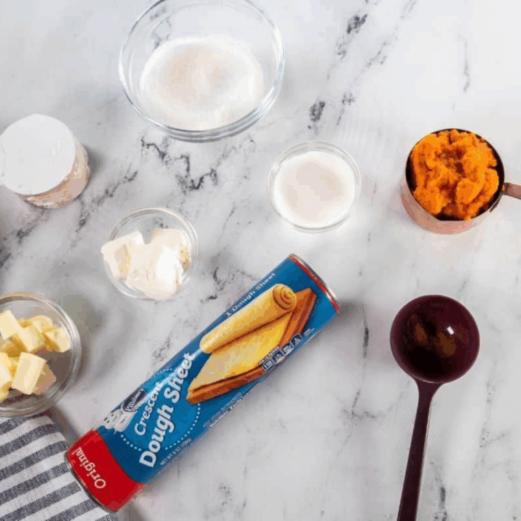 Ingredients needed for Easy Easy Air Fryer Pumpkin Spice Bread Twist on kitchen table.