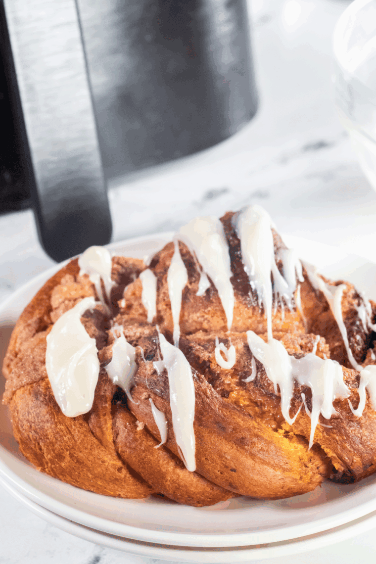 golden brown pumpkin spice bread twist with cream cheese glaze fresh from the air fryer