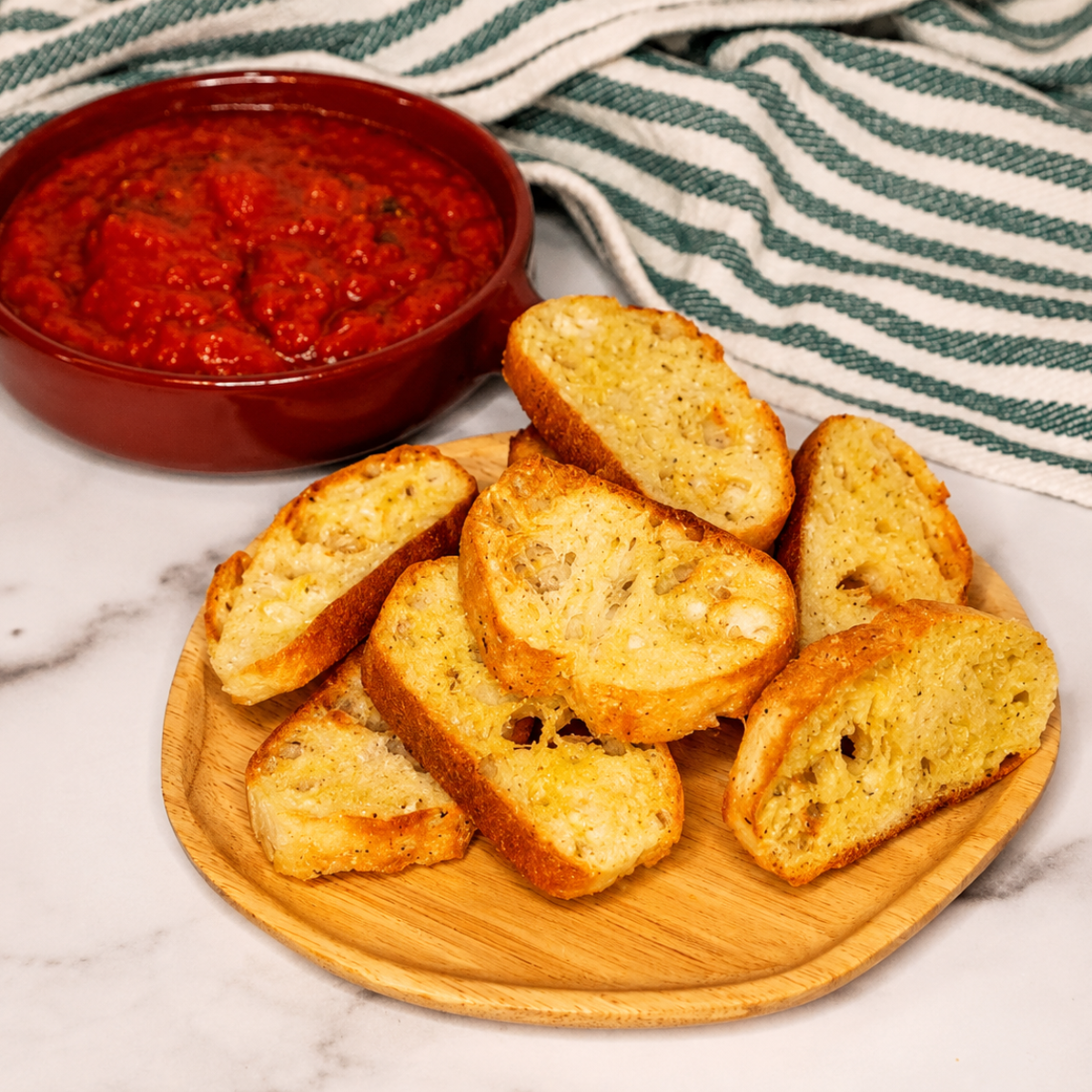 Sprinkling flaky sea salt over freshly toasted crostini