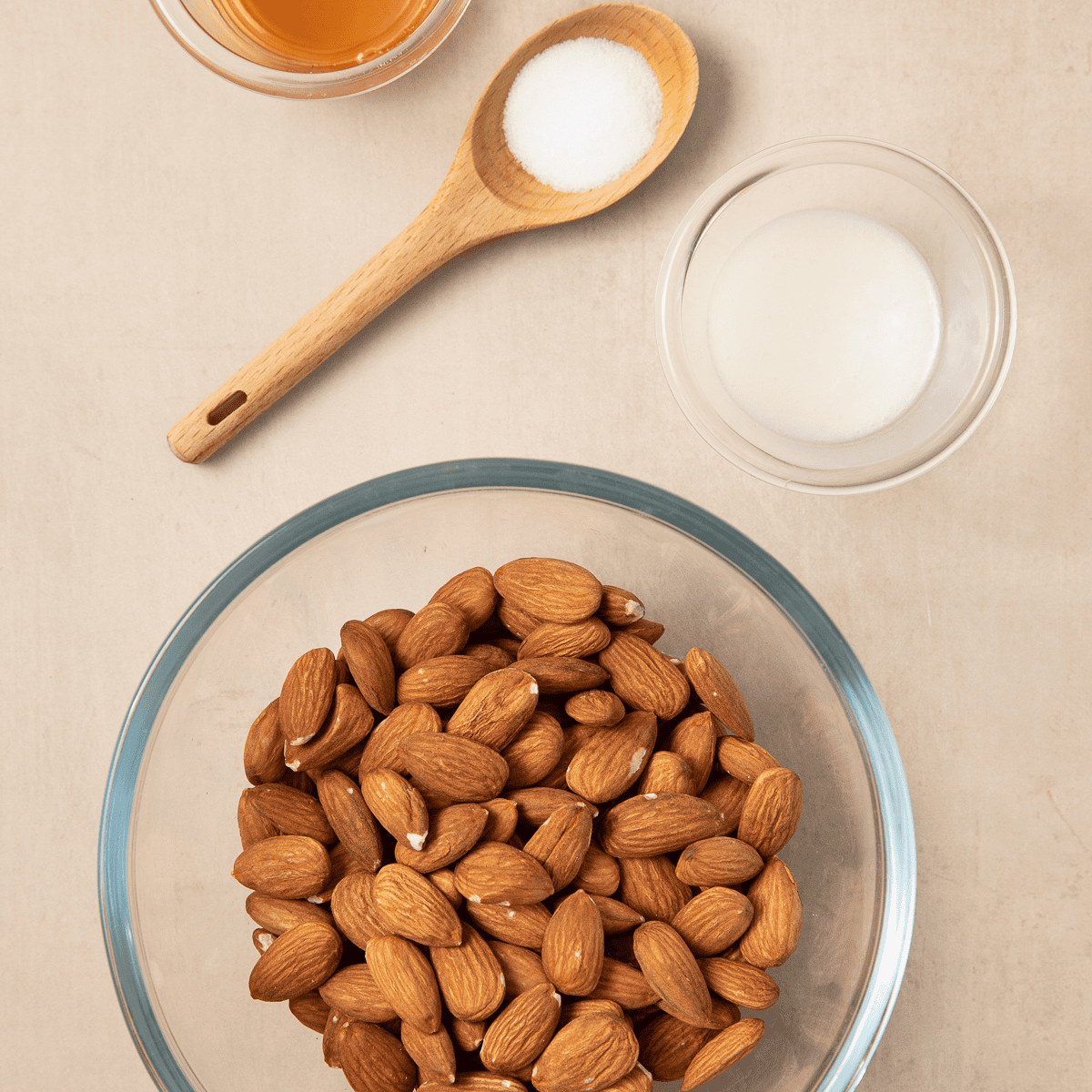 Raw almonds, honey, sugar, and salt for air fryer honey roasted almonds
