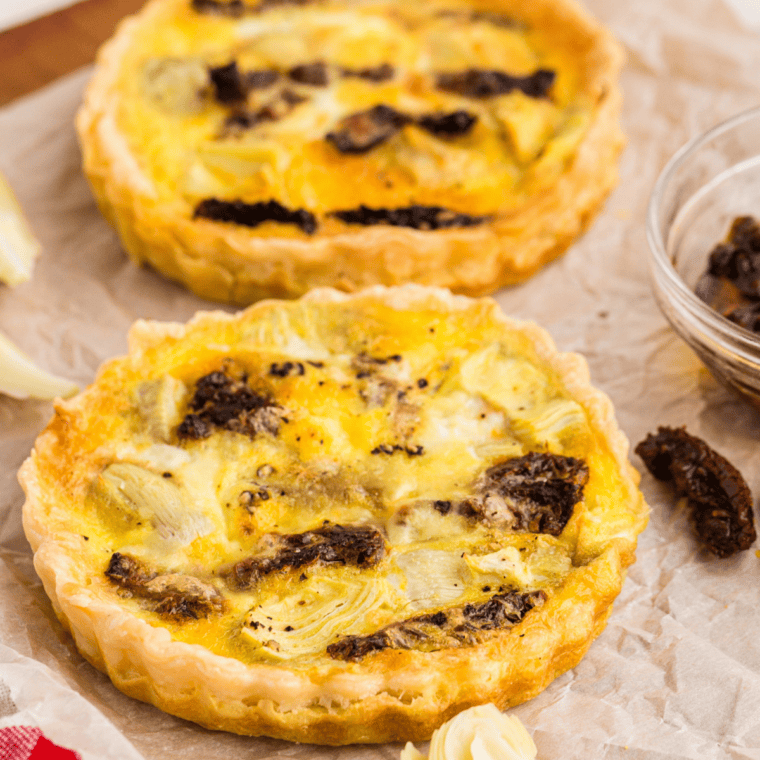 Golden, set air fryer quiche removed from the tart pan and cooling on a rack