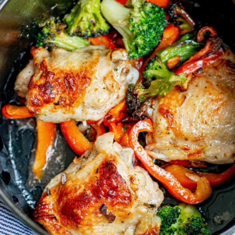 Prep the chicken: Brushing leftover chicken thighs with a light coat of oil before reheating in the air fryer