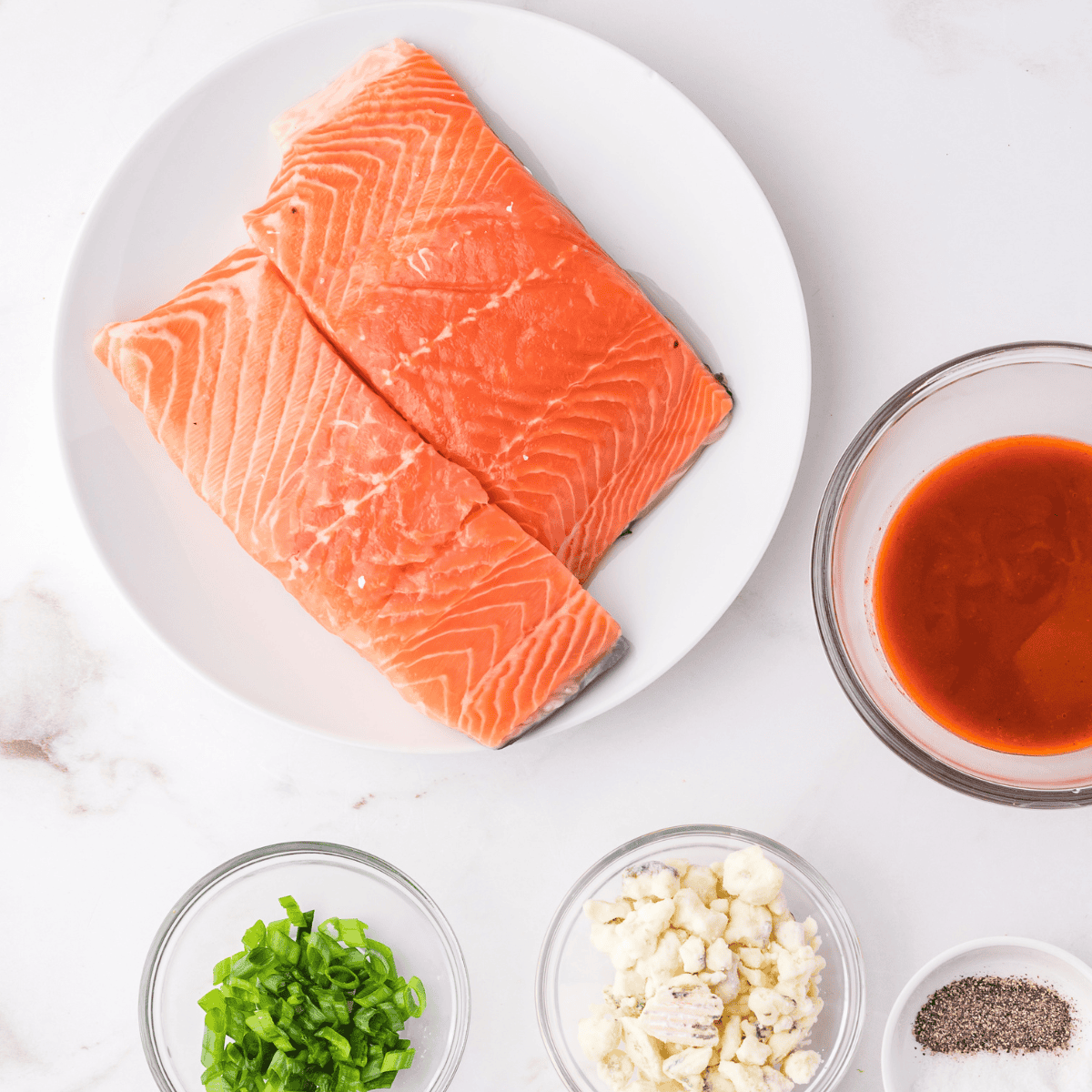 Ingredients needed for The Best Easy Air Fryer Pistachio Crusted Salmon Recipe on kitchen table.