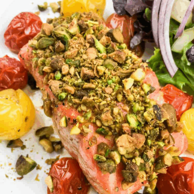 Crispy pistachio-crusted salmon cooked in the air fryer, served on a plate