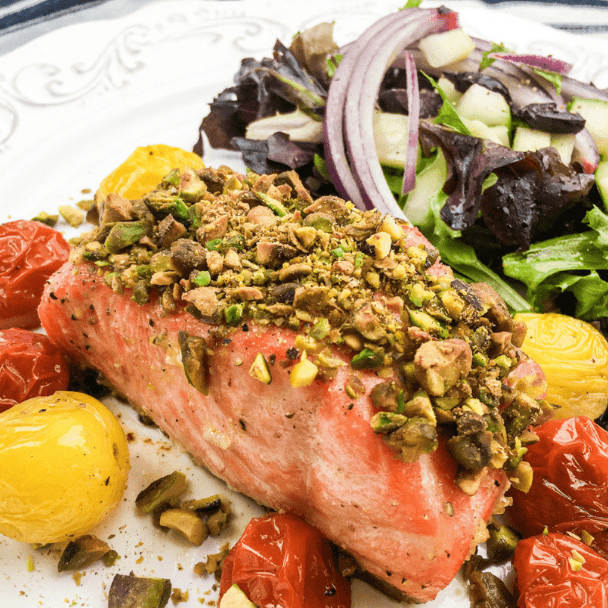 Crispy pistachio-crusted salmon cooked in the air fryer, served on a plate