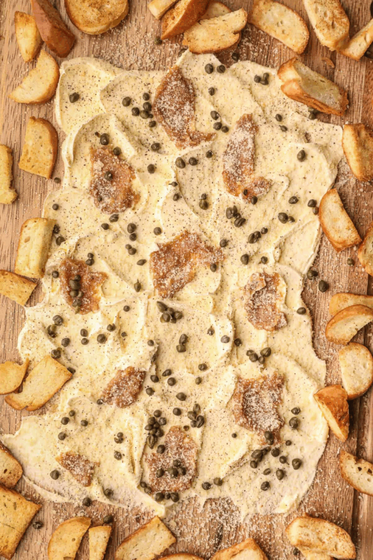 Colorful Easy Viral TikTok Butter Board with herbs, spices, and toppings ready to serve.