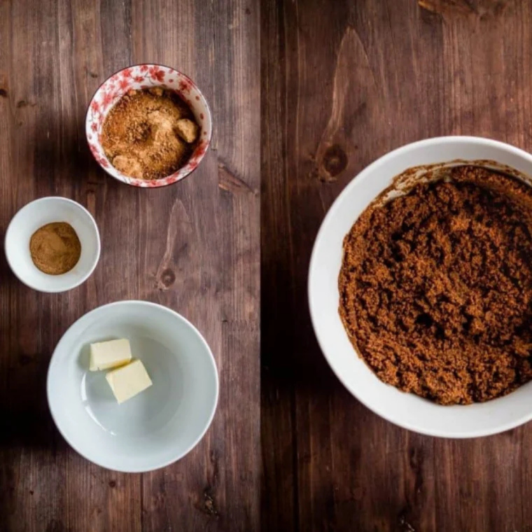 : Rolled-out dough brushed with melted butter and sprinkled with cinnamon sugar