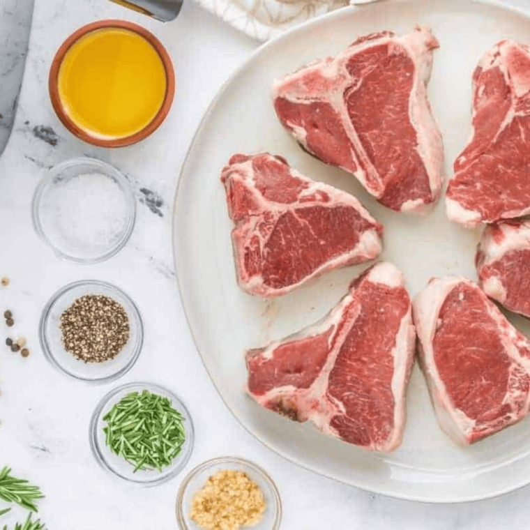 Ingredients for air fryer frozen lamb chops: lamb chops, oil, lemon zest, rosemary, salt, and pepper