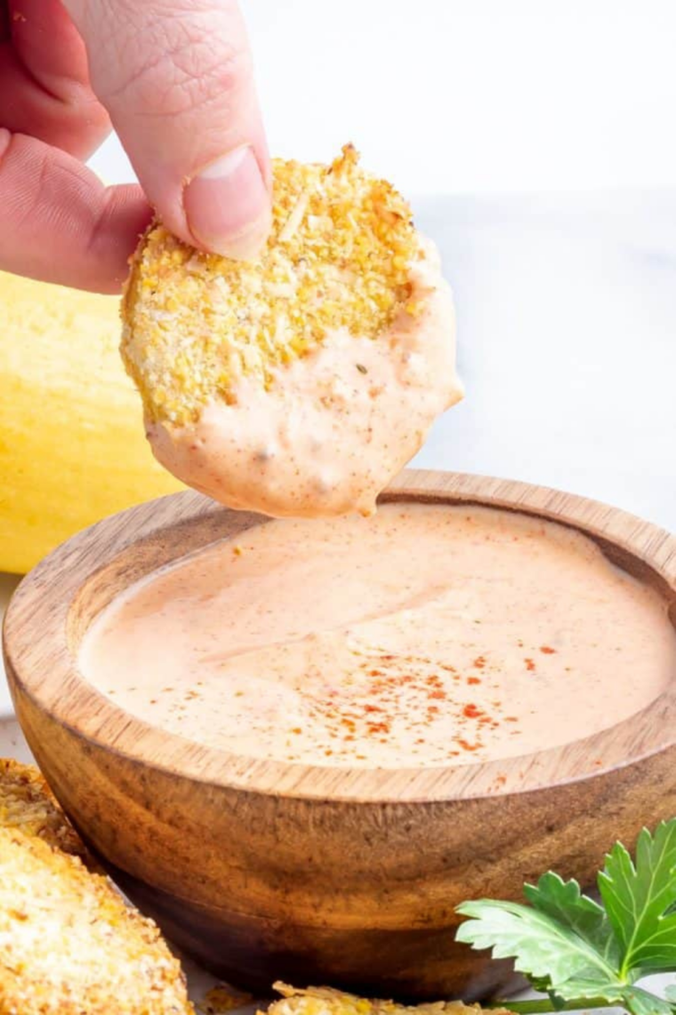 Crispy air fryer yellow squash rounds golden and crunchy on plate