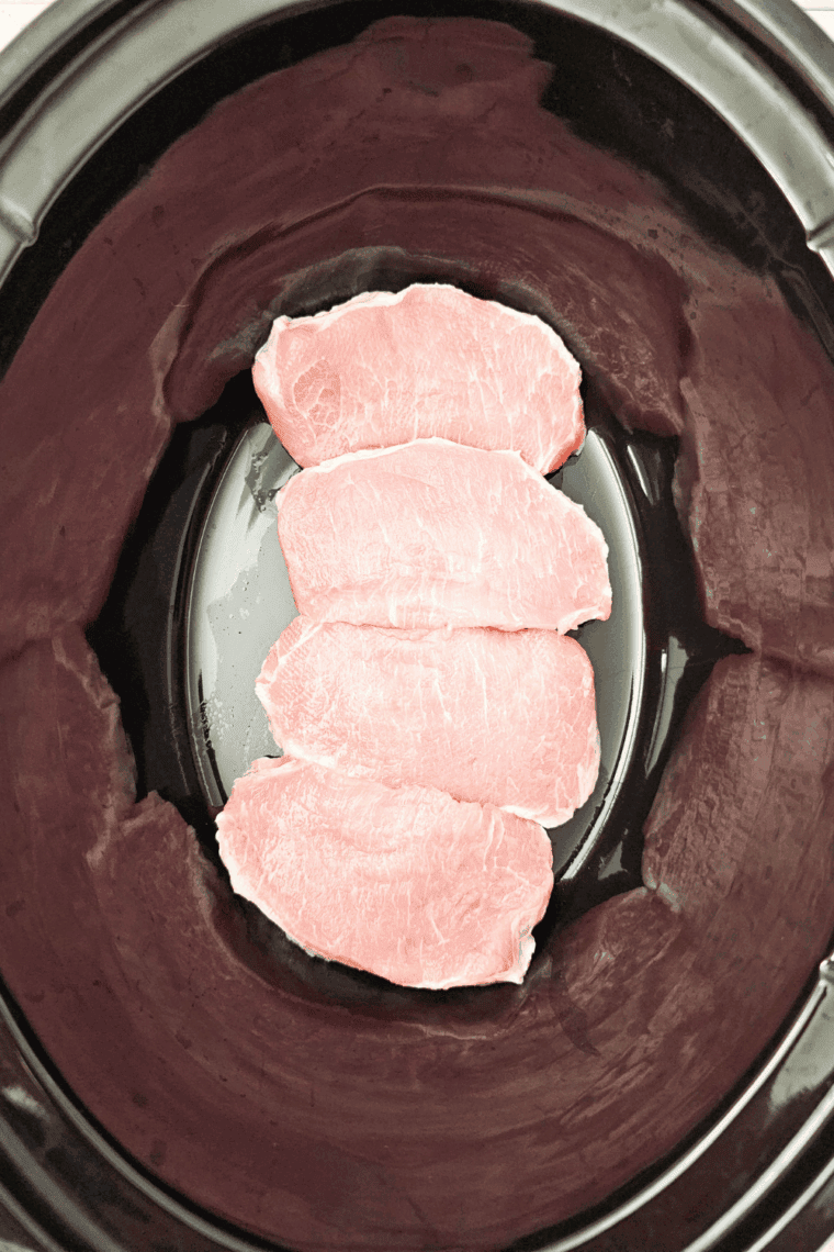 Place pork chops in the bottom of the crockpot.