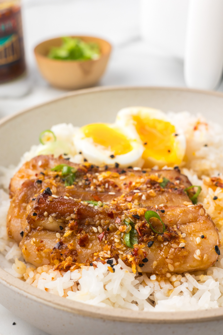 Cooling air fryer jammy eggs in ice bath before cracking and peeling under running water for smooth shell removal and clean finish
