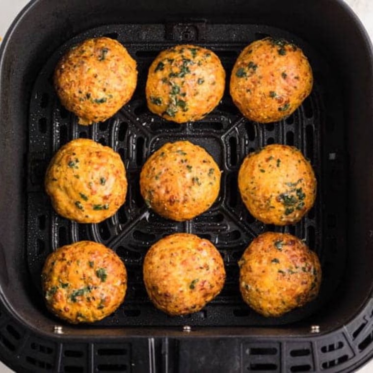 Air frying cheese puffs in a single layer until golden brown and crisp