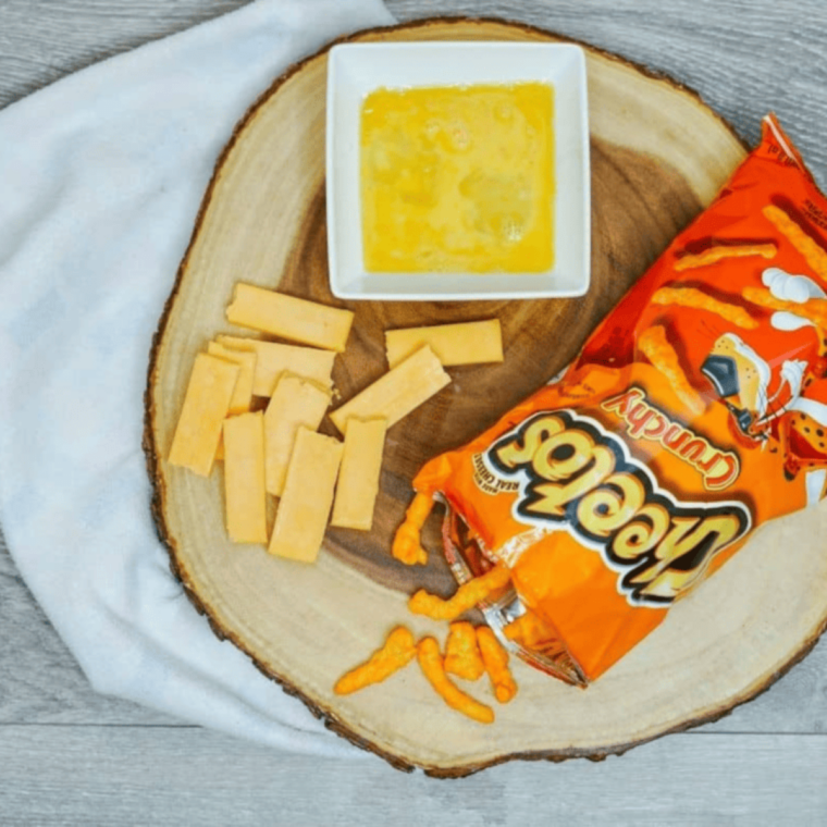 Ingredients needed for Air Fryer Cheetos Mozzarella Sticks on kitchen table.