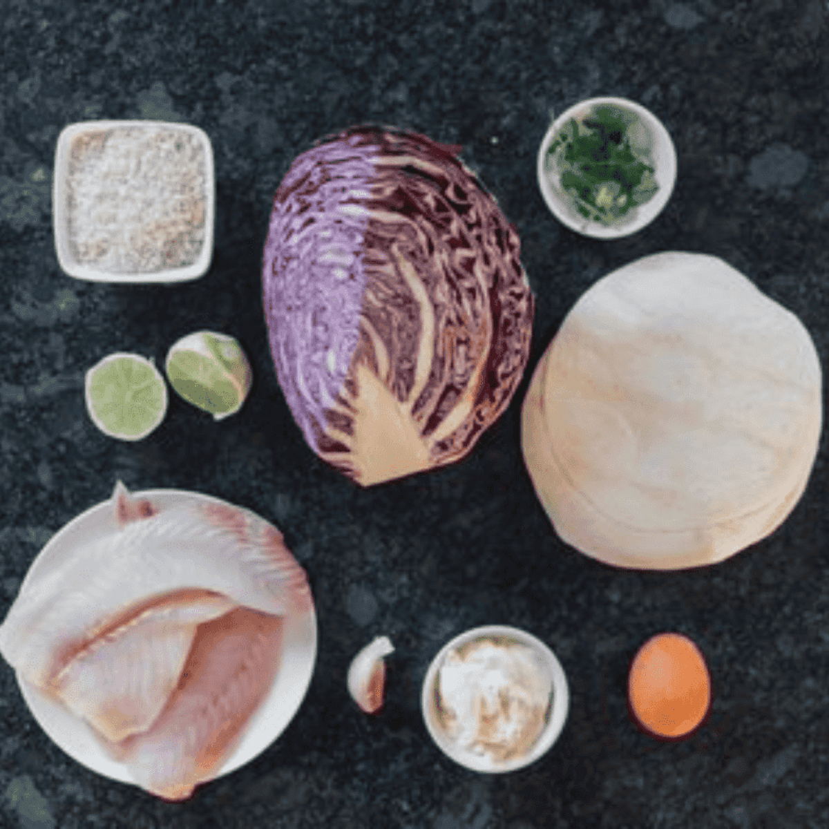 Ingredients needed for Bonefish Grill Blackened Baja Fish Taco Recipe on kitchen table.