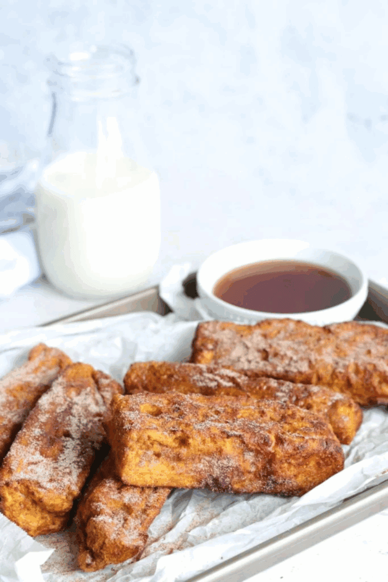 Golden Ninja Foodi French Toast slices on a plate with syrup