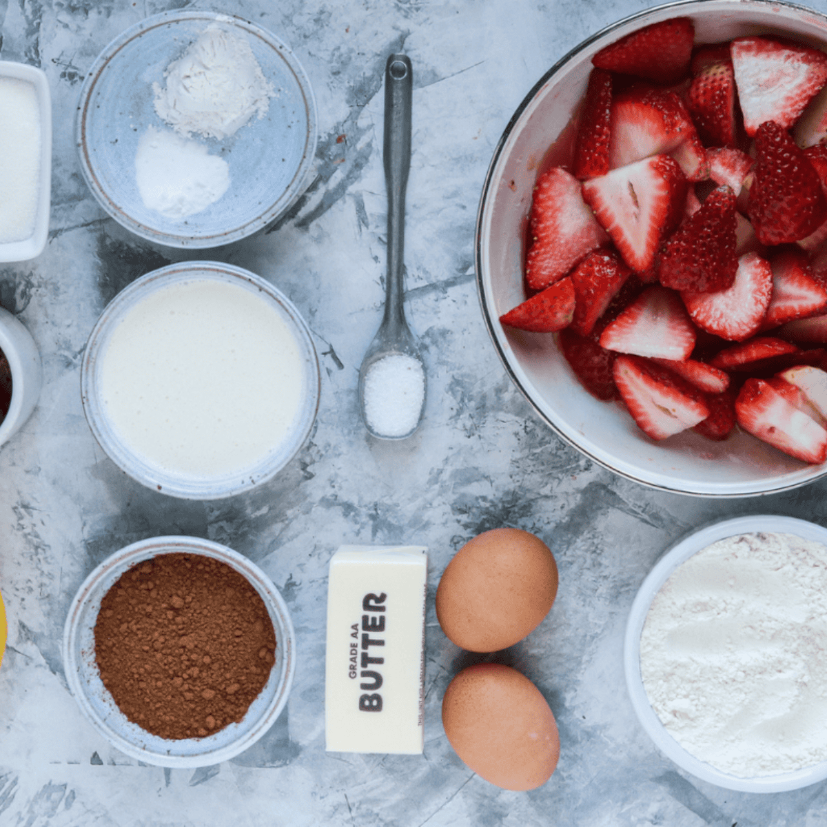 Ingredients needed for Easy Air Fryer Chocolate Strawberry Shortcakes on kitchen table.