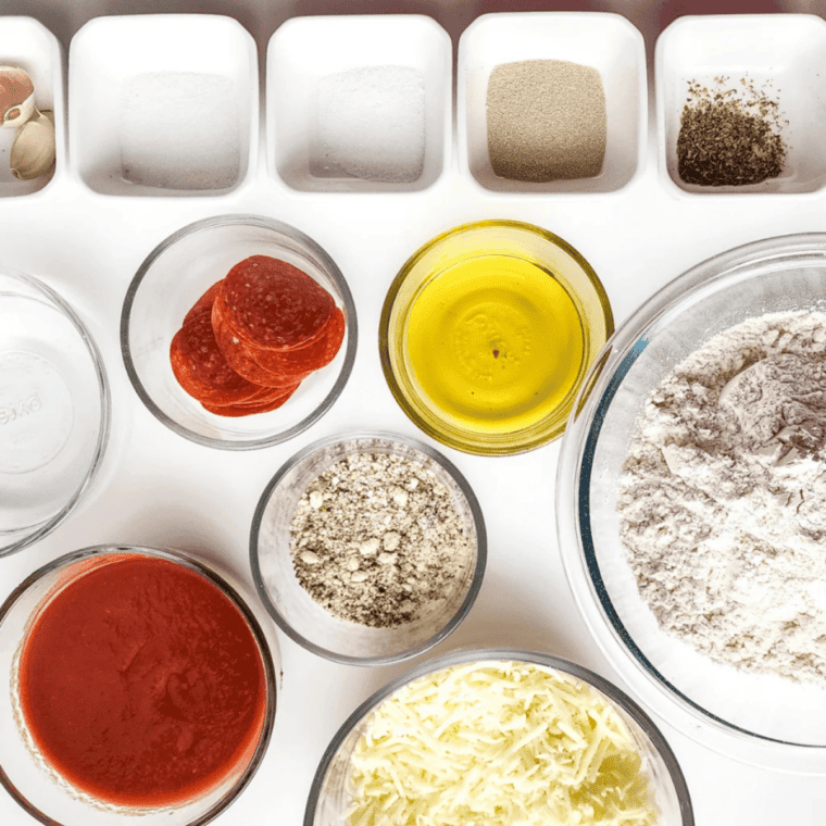 Ingredients for air fryer copycat Pizza Hut pan pizza: pizza dough, sauce, mozzarella, Parmesan, oregano, and pepperoni
