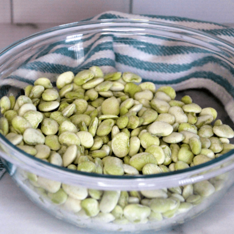 Ingredients needed for Air Fryer Lima Beans on kitchen table.