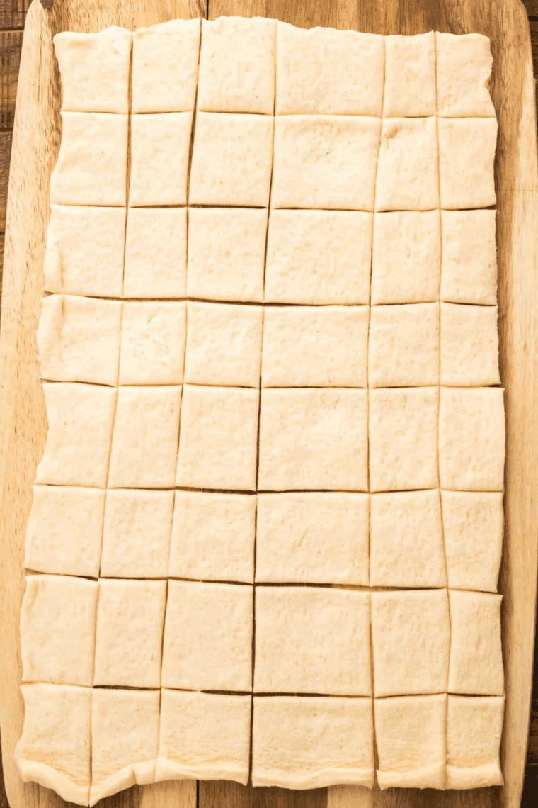 Use a pizza cutter to cut dough into 1” pieces.