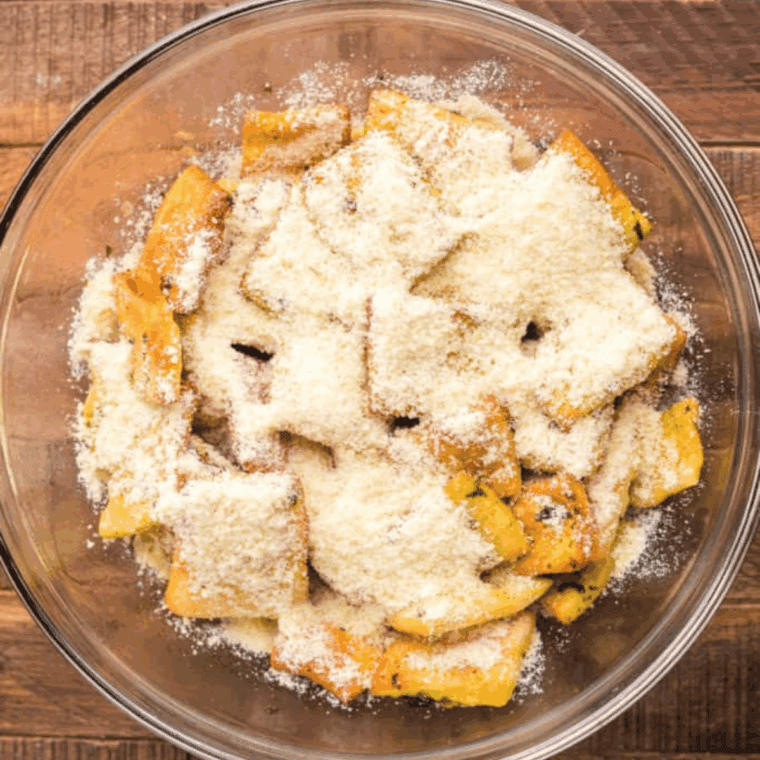 Combining grated Parmesan cheese and garlic salt in a small mixing bowl for the final seasoning blend.