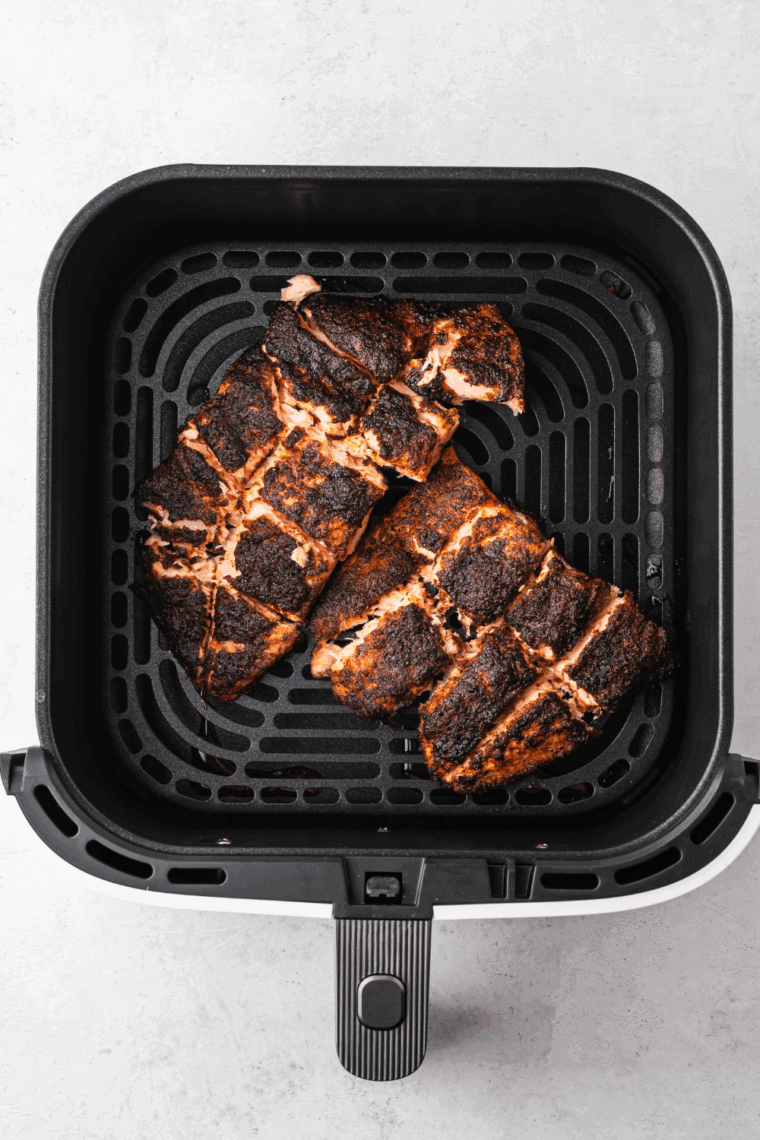 Air-fried salmon drizzled with fresh lemon juice and sprinkled with herbs