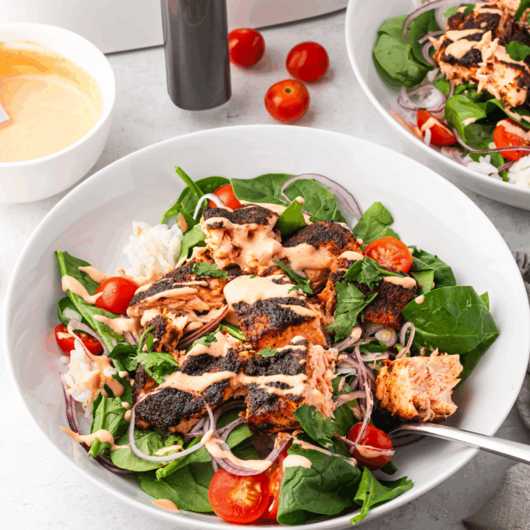 Air fryer BBQ salmon fillet, glazed, golden, and served with herbs