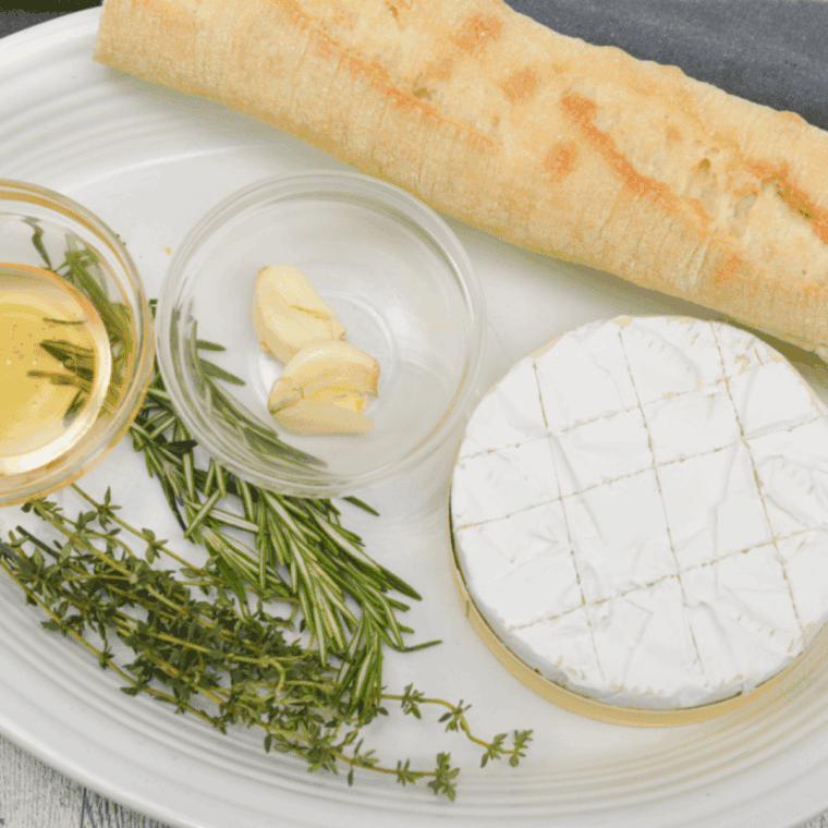 Ingredients needed for Easy Air Fryer Baked Camembert on kitchen table.