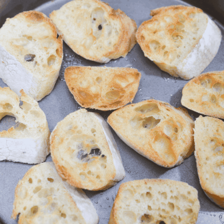 Plate of crostini in a pan.