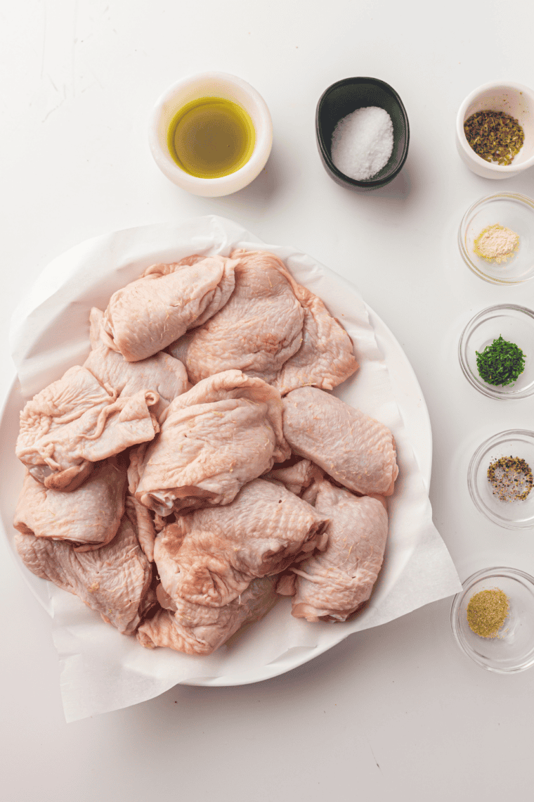 Ingredients needed for Air Fryer Chili Lime Chicken Thighs on kitchen table.