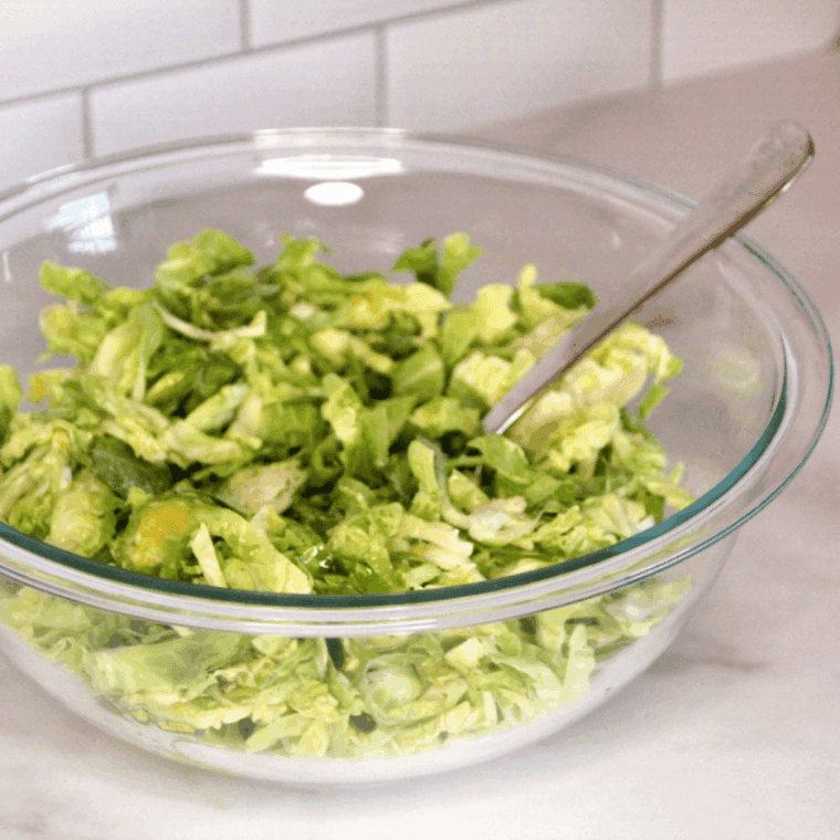 Ingredients needed for Easy Air Fryer Crispy Shaved Brussels Sprouts on kitchen table.