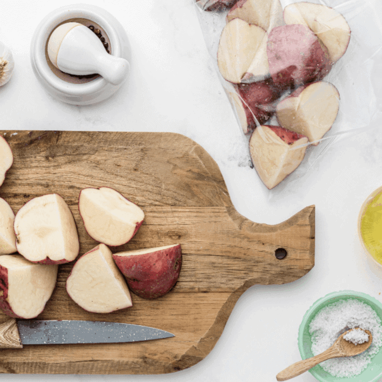 Cubed baby potatoes in a bowl, ready for air fryer preheating at 400°F.