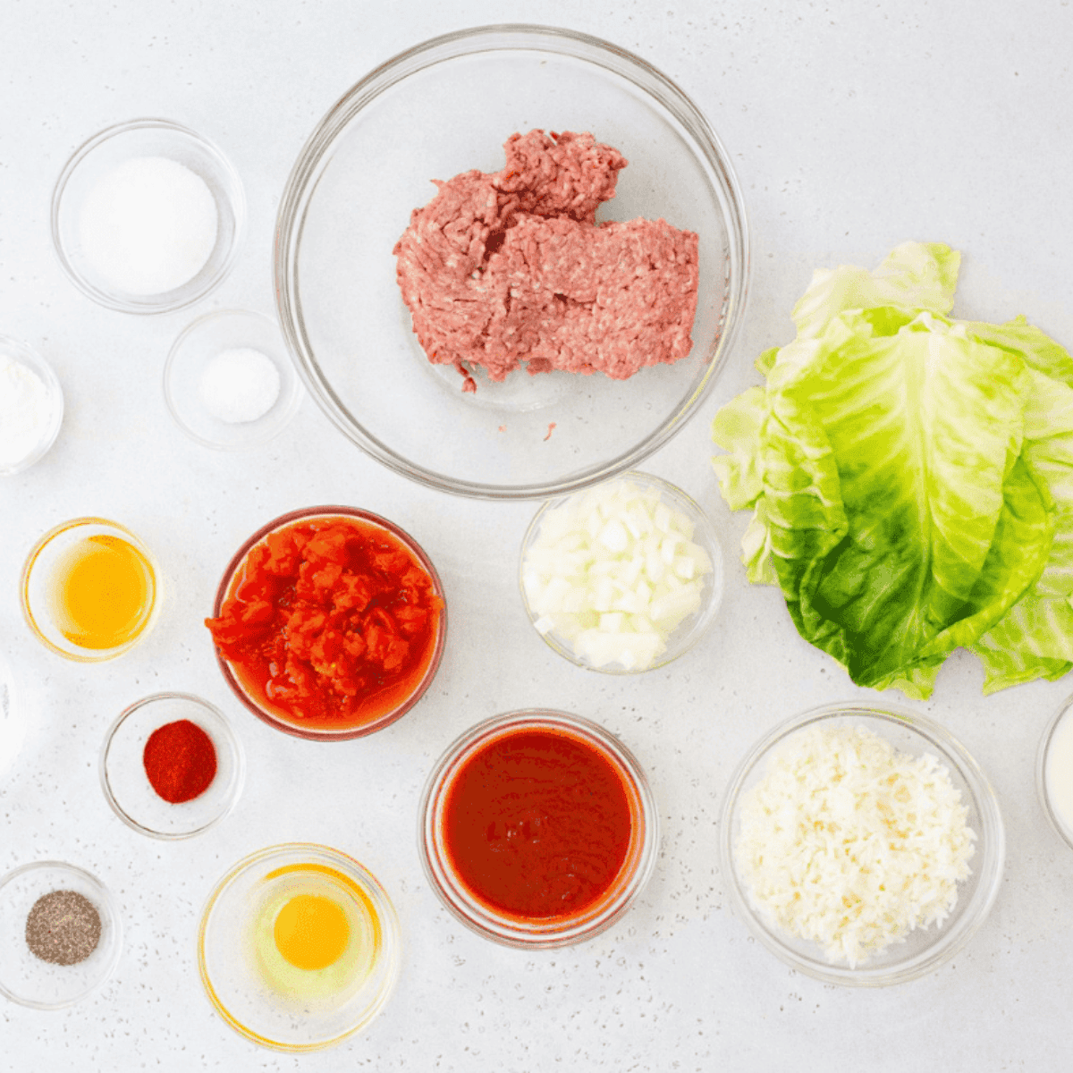 Ingredients needed for Air Fryer Stuffed Cabbage Rolls on kitchen table.
