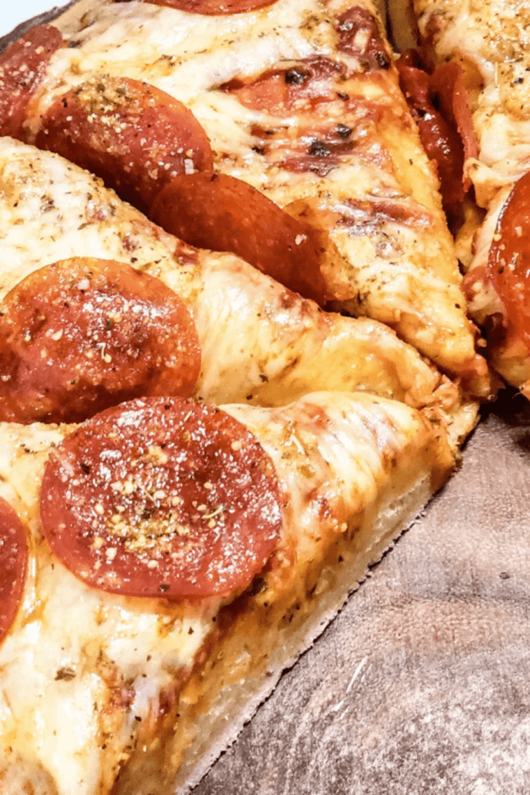 Bowl of smooth, homemade Little Caesar&rsquo;s pizza sauce ready to spread on pizza crust