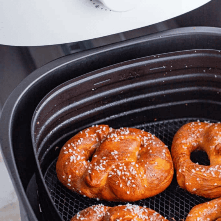 Air fryer copycat Auntie Anne's pretzels brushed with butter and sprinkled with salt