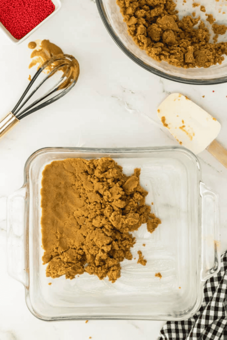 Gingerbread cookie dough pressed into a pan, baking in air fryer and cooling after cooking.