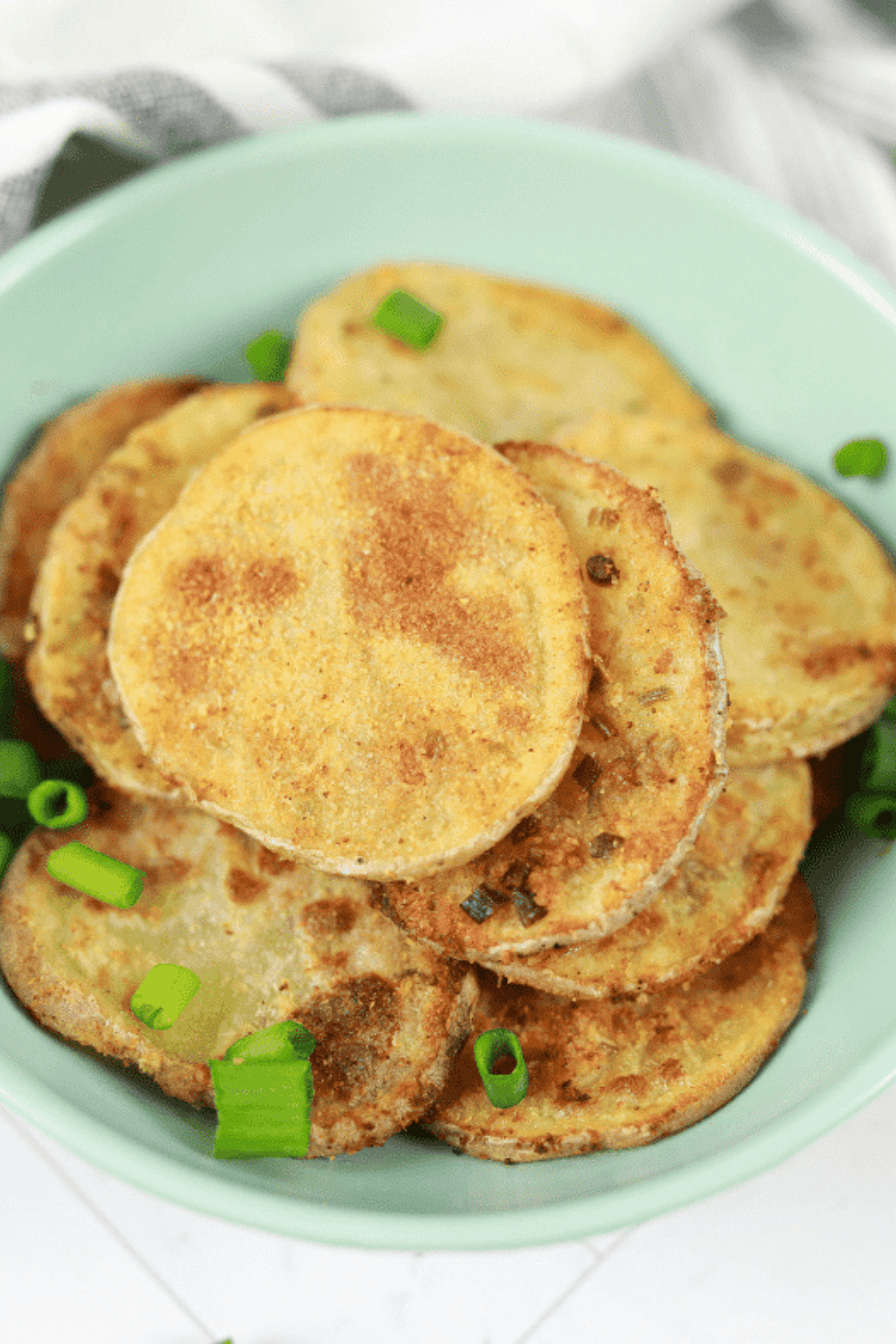 Golden, crispy sour cream and onion potato chips fresh from the air fryer.