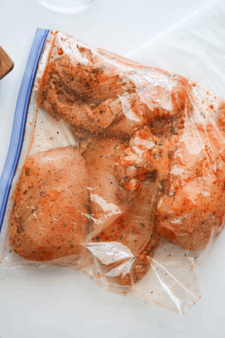 Chicken cooking in air fryer basket at 370 degrees