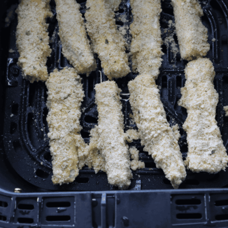 Place coated eggplant fries in air fryer, spray with oil, cook at 400&deg;F, flipping halfway.
