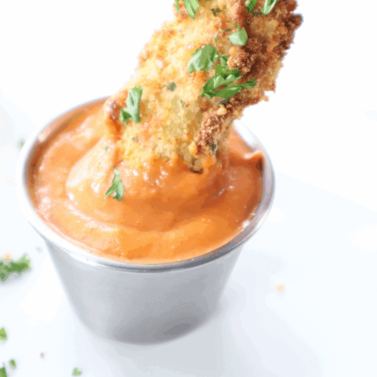 Crispy golden air fryer eggplant fries in a basket, ready to serve.