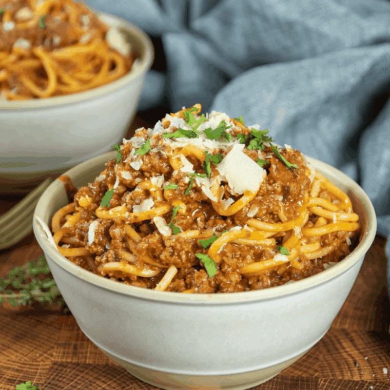 Ninja Foodi spaghetti with tender noodles and rich, flavorful meat sauce served in a bowl.