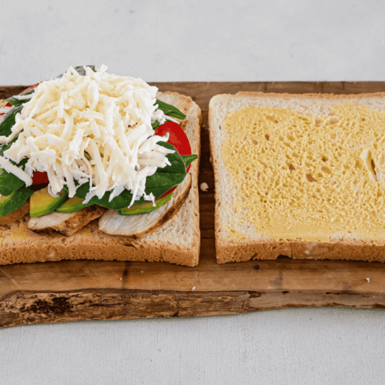 Air Fried Chicken and Avocado Sandwich with fresh toppings.