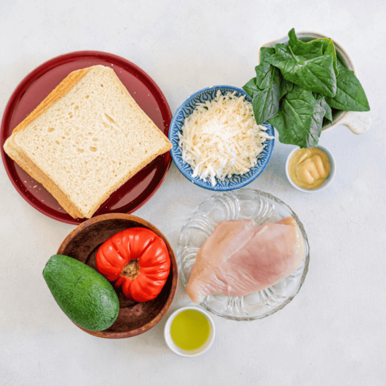 Ingredients needed for Air Fryer Copycat Panera Chipotle Chicken Avocado Melt on kitchen table.