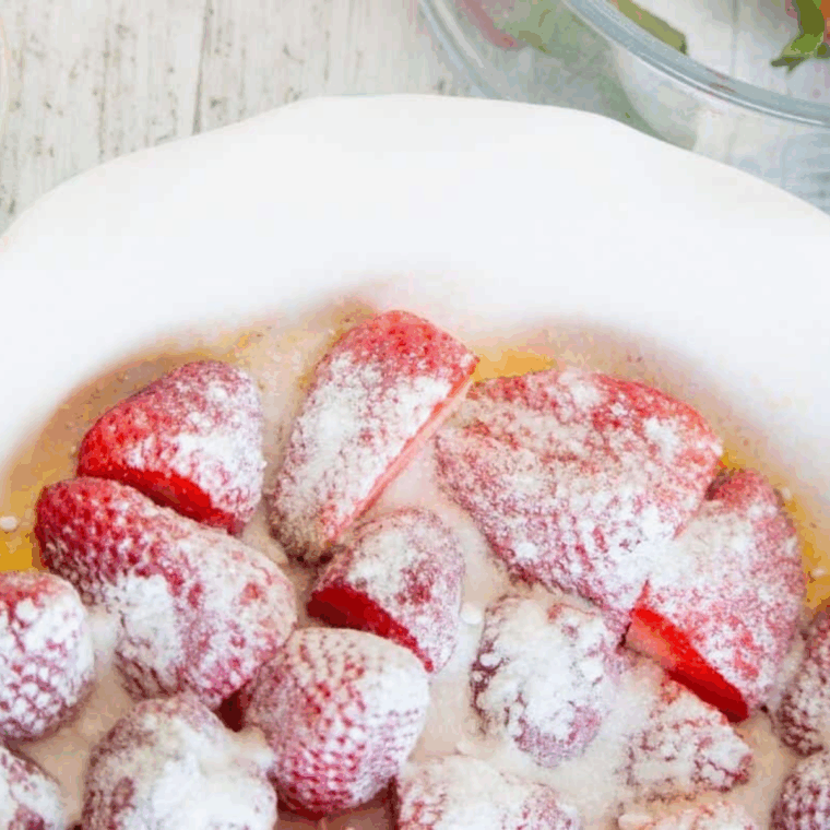 Baking dish sprayed with cooking spray, filled with strawberries, topped with sugar and cornstarch mixture.