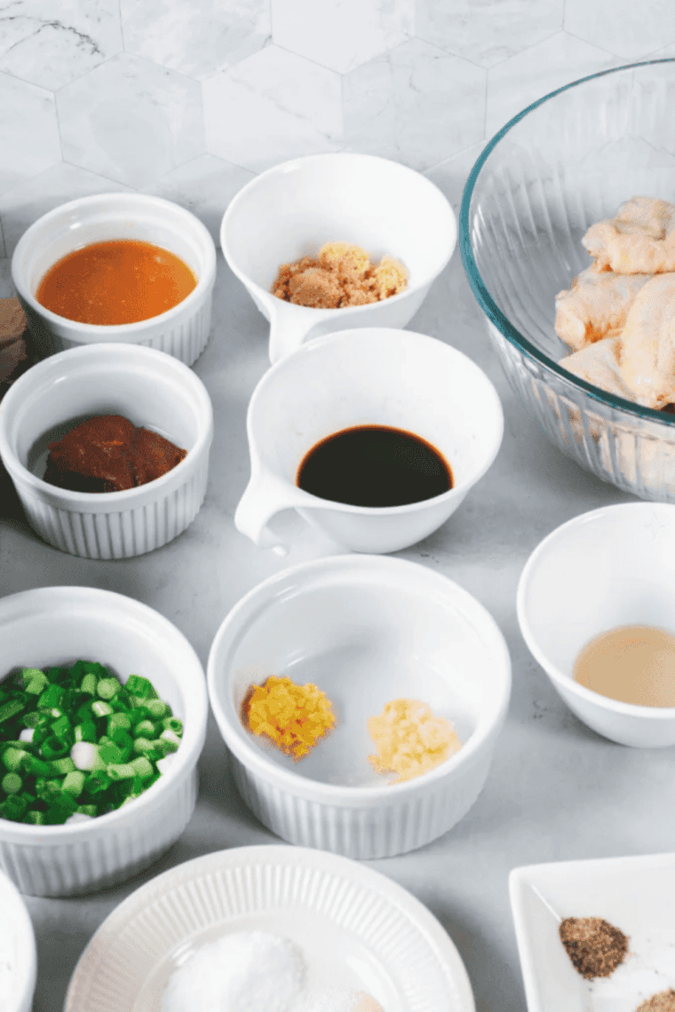 Ingredients needed for Crispy Copycat Wingstop Atomic Wings Recipe on kitchen table.