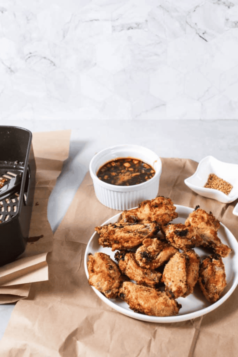 Crispy Copycat Wingstop Atomic Wings coated in fiery hot sauce